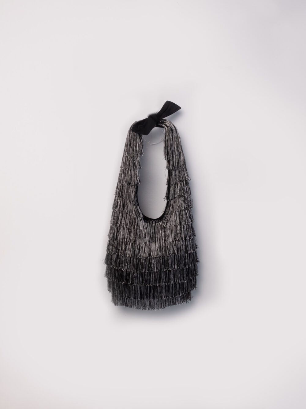 Silver bag fully covered with fringes